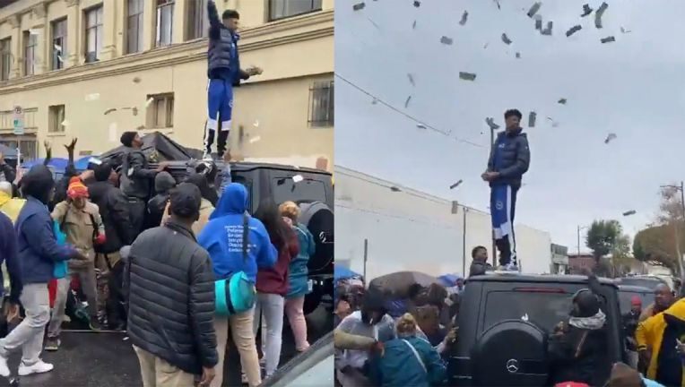 بالفيديو .. مغني أمريكي يلقي الأموال على الناس في الشارع